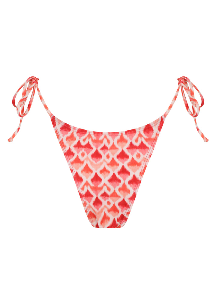 Back of Juicy Classic Bottoms with red and white ikat-pattern bikini bottom with high-cut sides, adjustable hip ties, cheeky coverage on white backdrop.
