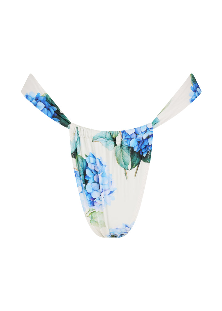 White Fleurs Ruched Bottoms in vibrant blue hydrangea floral print with green leaves, with adjustable ruching for a cheeky fit and cheeky coverage.
