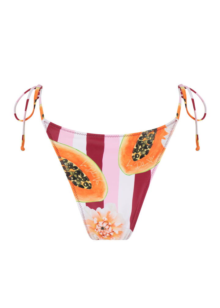 Back view of women's Dolce Vita Classic Bottoms triangle style with ties in bold red and white vertical stripes, featuring vibrant sliced papaya illustrations and a small flower accent below, cheeky coverage, against a plain white backdrop.