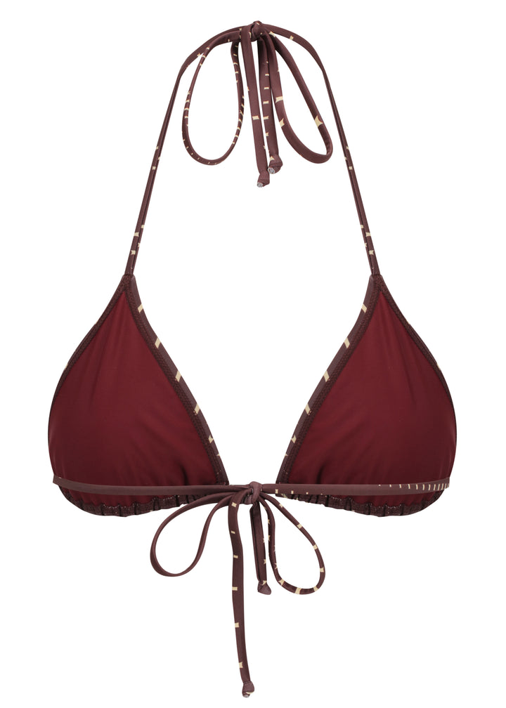 Dark brown Isla Top bikini top triangle halter inner view with maroon cloth cups, with a pattern of small beige four-pointed stars, halter-style straps are tied at the top on a white backdrop.
